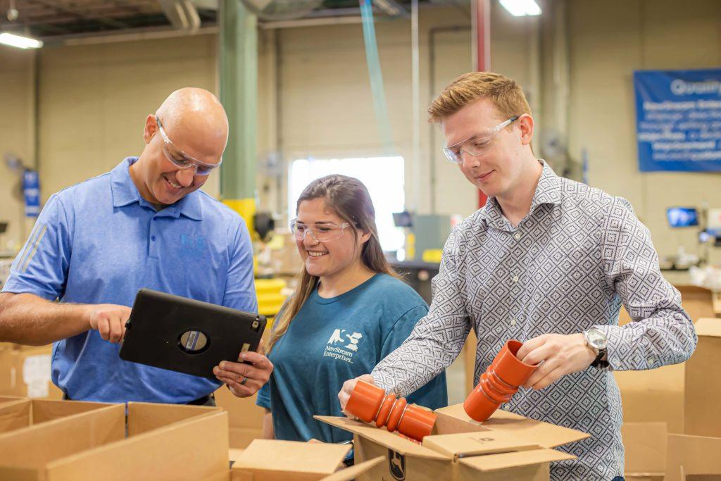 NewStream employees assembling products